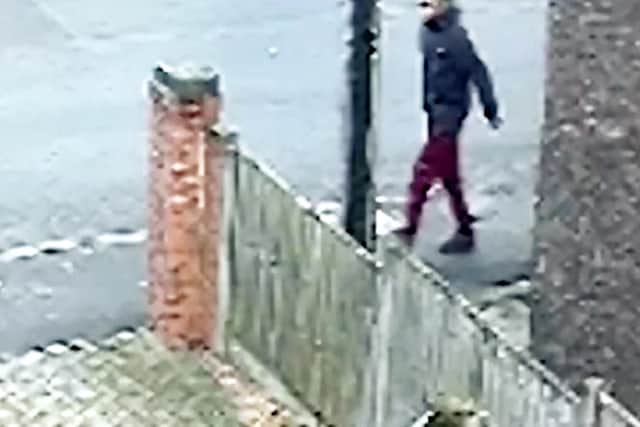 Police investigating a theft in Pinxton, Derbyshire, want to speal to this man (pic: Derbyshire Police/SWNS)
