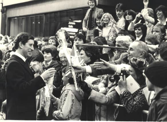 Prince Charles is greeted by crowds during his visit to Chesterfield to open the Pavements Shopping Centre.