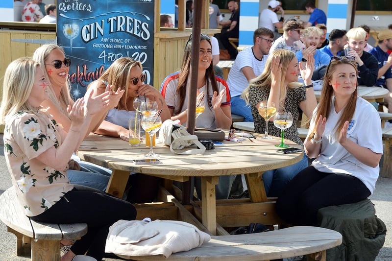 Outdoor drinkers at the Spotted Frog, in Brampton, watch England's 2-0 Euro 2020 win over Germany in June last year.