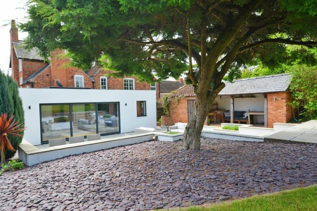 Our last photo of the £1.25 million Southwell house shows how the sliding doors of the family room or garden room open out on to a patio terrace.