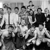 Chris Marples, pictured centre holding the Canon League Division Four championship trophy, in May 1985, after the last game of the season. 