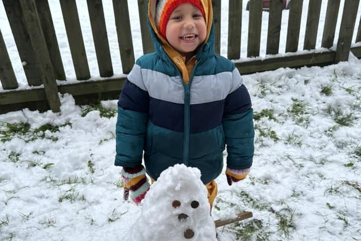 Sarah Paterson's three-year-old son looks very proud of his snowman