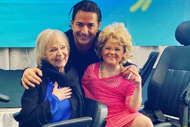 Phoebe with, Mateo (Jake Canuso) and Madge (Sheila Reid) on her mobility scooter.