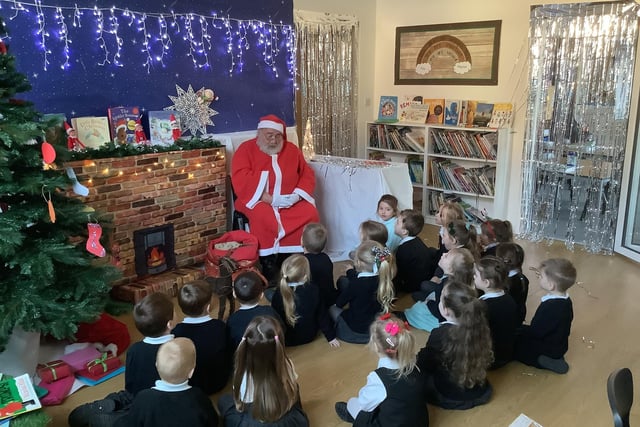 Father Christmas read the children a story