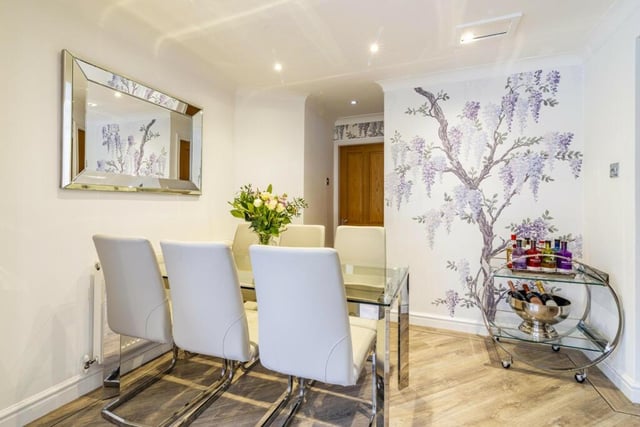 Also adjoining the kitchen at the £750,000 property is this stylish dining area.