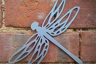 Metal dragonfly, which is unpainted, will rust over time for a more natural effect.