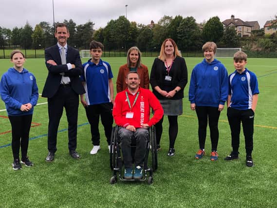 Ryan Cowling (GB Wheelchair Rugby Gold medallist) photographed with Y9 students Amelia, Zack, Megan and Evan, Andrew Marsh (Headteacher), Alison Watson (School Business Manager) and Angeline Ellson (Chair of Governors)