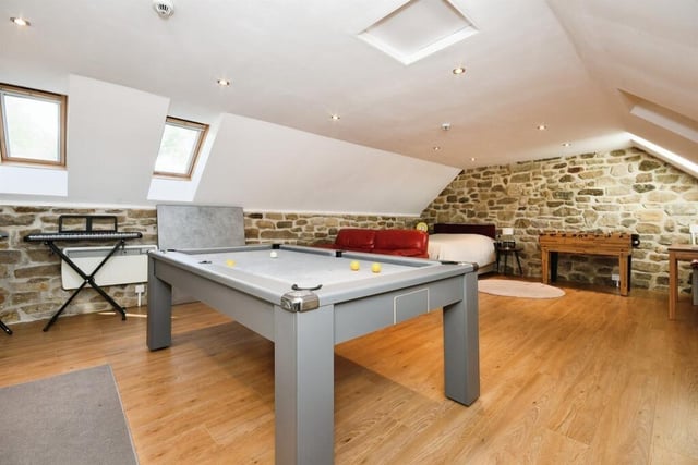The first floor of the barn currently houses a games room but could easily be used as living and bedroom space.