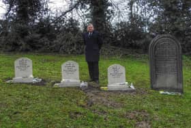 Coun Martin Thacker at the site of the new gravestones