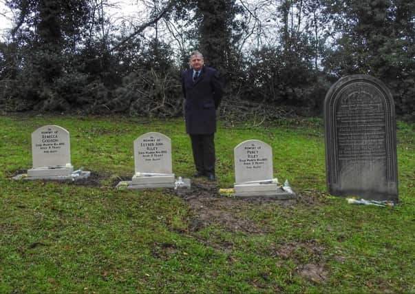 Coun Martin Thacker at the site of the new gravestones