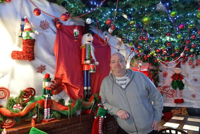 Mark Thomas, Landlord of The Hanging Gate in Chapel-en-le-Frith with the Christmas decorations the pub has kept up ahead of reopening on May 17.