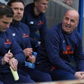 Paul Cook, pictured right, plans on making changes for the game against Dagenham and Redbridge.