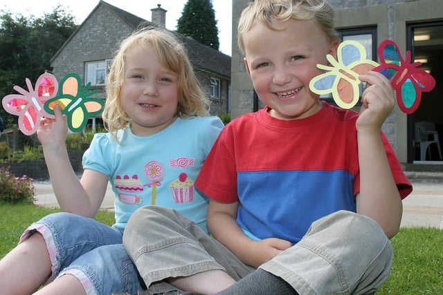 Preparing for Tideswell church flower festival in 2009, Jessica Williams and Tom Bower with some of the hundreds of decorations that went into the church
