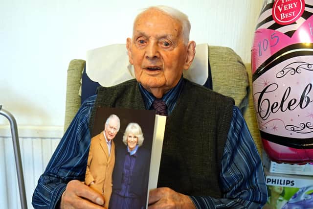 Henry Holmes with his birthday card from King Charles.