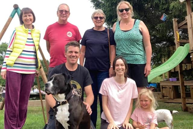 Clockwise from back left, Nataliia, Luci's mum and dad Toni and Sue Burnley, Luci, Anna-Marcelle, Sophie, Pierre and Winnie the dog.