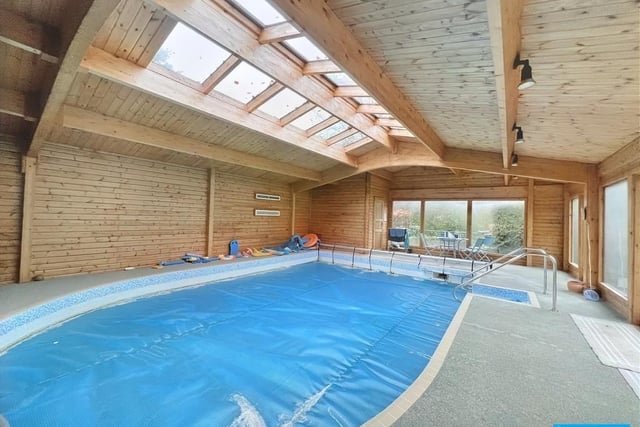 A heated pool is contained within the spacious wooden pool house which has a changing room with shower.