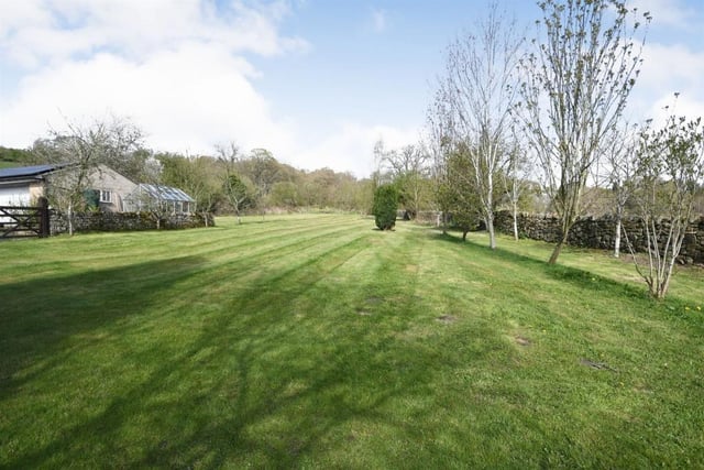 There are large expanses of grassed areas surrounding the property which sits in 1.53 acres.
