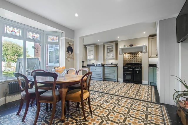 This spacious room is ideal for entertaining family and guests as it  is open to the kitchen and has a large bay window looking out over the rear garden.