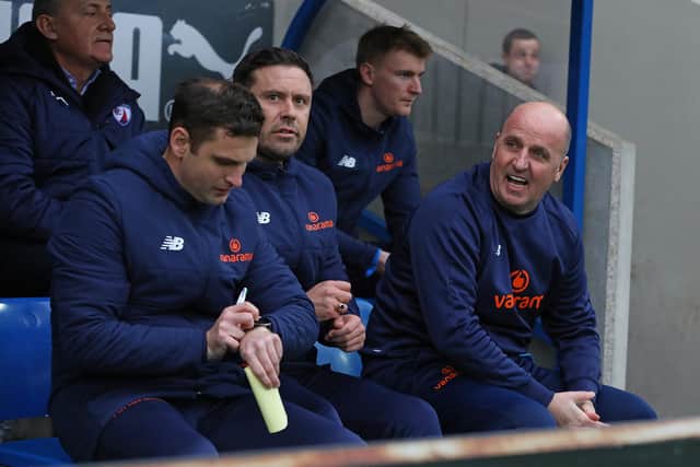 Paul Cook took charge of his first home game since returning to the Spireites.