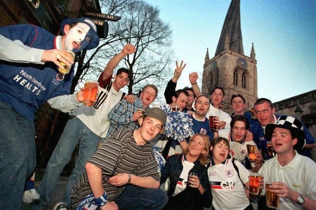 Chesterfield fans celebrate after the 3-3 draw in front of the crooked spire.