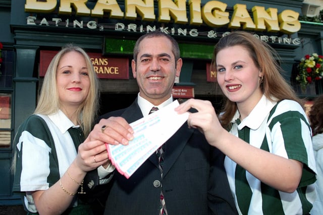 Brannigans general manager Bashir Rassas introduces the Millenium tickets to Michelle McNeal (left) and Kelly Ward in 1999