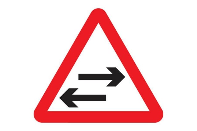 A. Look left and right
B. Traffic in both directions
C. You may turn left or right
D. Two way traffic crosses one way road