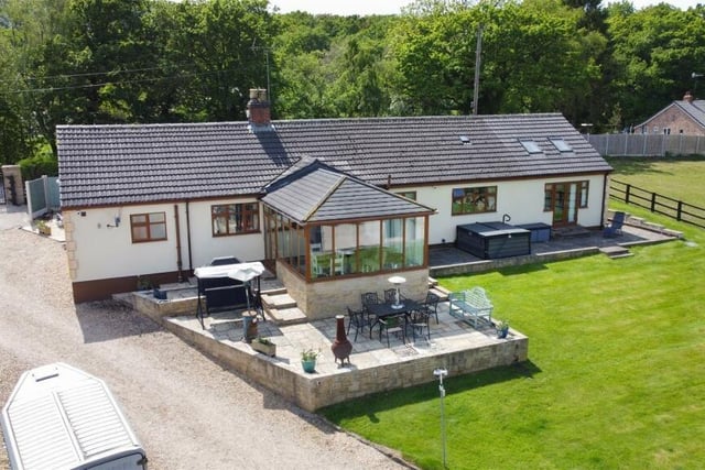 The four-bedroom bungalow enjoys views of the countryside.