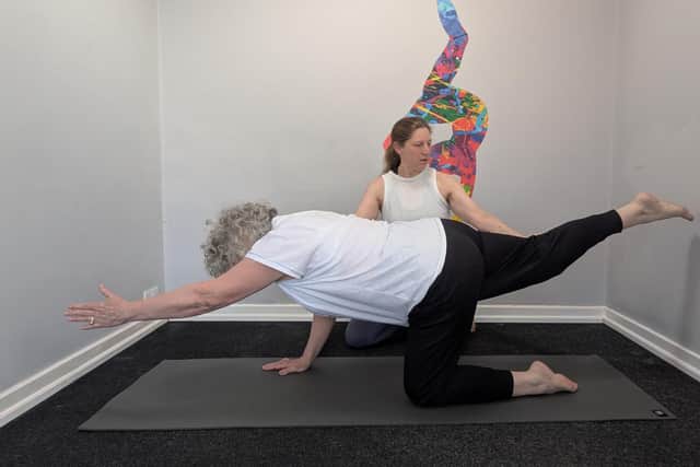 Gila Archer teaching matwork Pilates to a patient.
