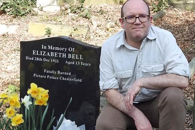 Darren Wall at the graveside of his great-great aunt Lizzie Bell who died in Chesterfield in 1911.