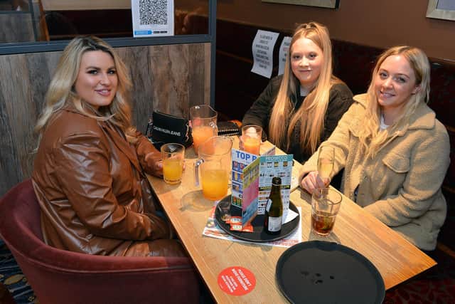Pubs reopen indoors after lockdown.  Harriet Whiteley, Rosie Bowan and Chloe Watts at Chesterfield's Spa Lane Vaults.