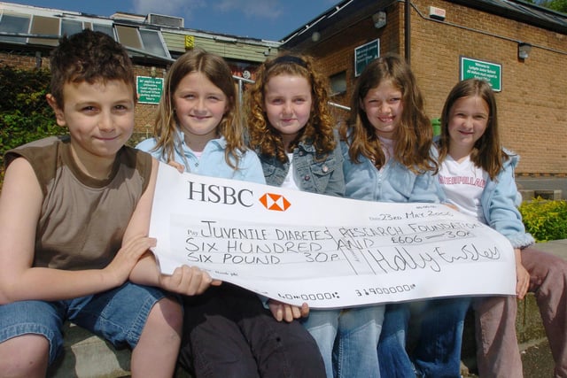 Holly Emsley, centre with her friends, Giovanni Lanera, Sarah Platts, Evie Billingham and Bethany Martin with a cheque for the Juvenile Diabetes research Foundation at Lydgate Junior School pictured in 2006