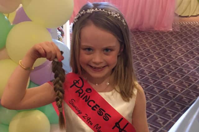 Holly was very pleased to give away her ponytail before starting to grow another donation. (Photo: Steph Goodwin)