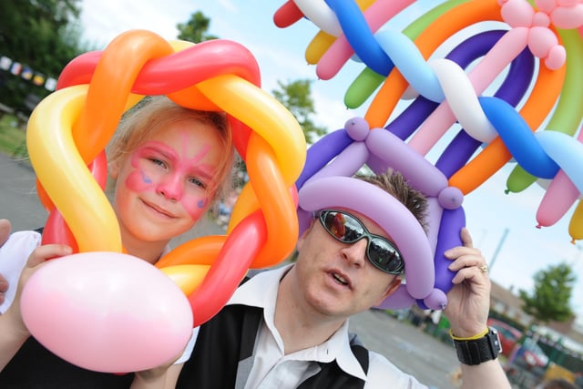 Biddick Infants School Family Fun Day and Amy Baker is pictured with balloon modeller Magic John in 2015.