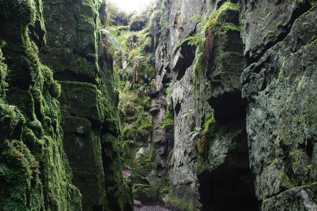 A congregation of the 15th century Lollards persecuted sect is believed to have worshipped in secret in this rocky cleft which is thought to be named after one of their supporters Walter de Ludbank who was captured. The three-mile walk leaves Gradbach car park, near Flash, climbs  through woodland to Castle Rock and then enters Lud's Church.