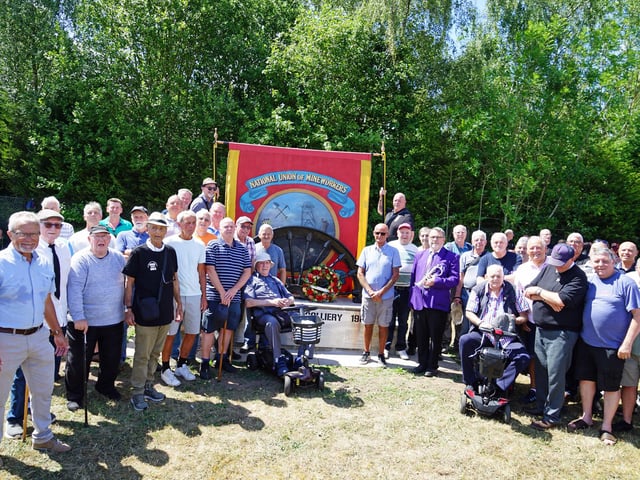 Former Arkwright miners gather at the memorial.