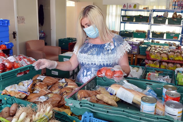 Volunteers launched Chesterfield Community Hub in March 2020 and by August had delivered 6000 food parcels to people in need. Shell Whitley sorting a food parcel.