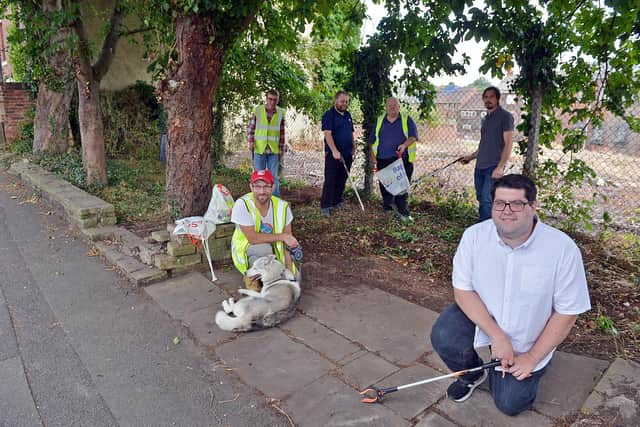 Members of Chesterfield and District Local History Society are breathing new life into the Coronation Gardens on Chatsworth Road. Back, Sean Crossland, Syd and John Barwick, Ben Laverick. Front, Ed Fordham with Sparky the Husky and Luke Povey.