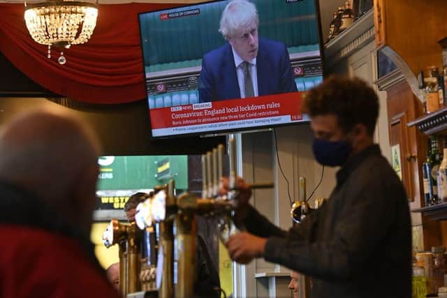 Boris Johnson has announced a new three-tier lockdown system (Photo by PAUL ELLIS/AFP via Getty Images)