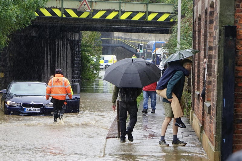 Derbyshire Times photographer Brian Eyre captured residents helping each other as the water rises in this part of Chesterfield.