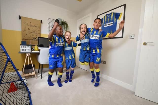 Players from Field Lane FC’s U8s in the bedroom of the Cutler showhome, which was designed in honour of the club.