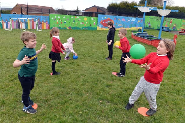 Year 2 pupils taking part in PE at  Henry Bradley Infant School
