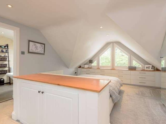 The master bedroom has space for a sofa/dressing area as well as a modern ensuite.