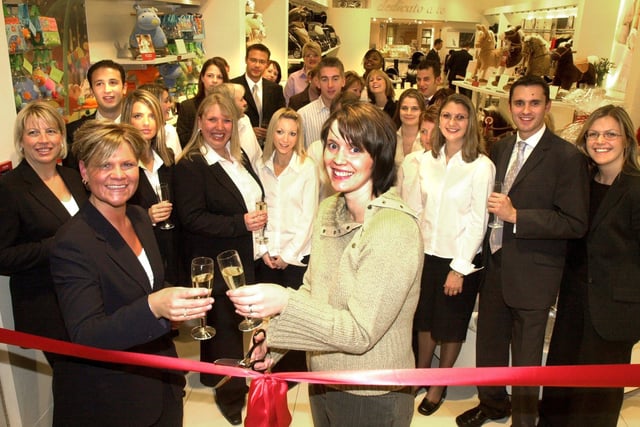 Meadowhall Mama's and Papa's store manager Karen Smith (left) and Midwife of the Years Angela Hewett(right) pictured at the store opening in 2003. Also pictured are staff and colleagues