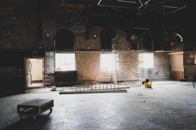 Work is underway to prepare the Pavilion's main hall for the possible return of events in the summer, with new flooring and the walls stripped back to the original brick.