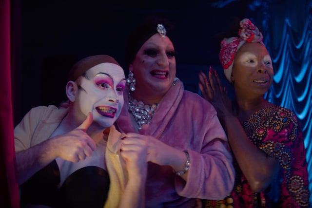 A scene featuring drag queens.