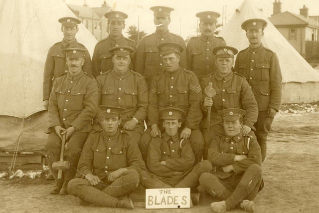 Army Service Corps soldiers with their name plaque 'The Blades', c. 1916