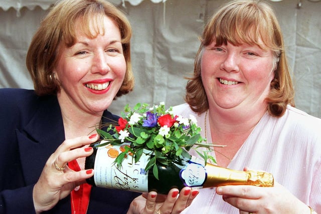 Doncaster College's Floristry Department threw open its doors to the public in 1998, to allow the town's budding florists the opportunity to show off their talents. Our picture shows OCN Floral Art student Kkathryn Moorhouse (right), of Thorne, with lecturer Julie Kaye. The decorated bottle was one half of a floral display designed to celebrate soccer's World Cup.