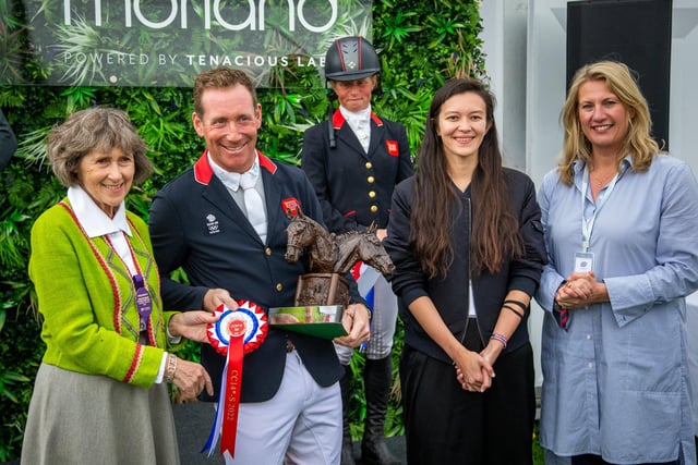 The Duchess of Devonshire presents Oliver Townend with the Chatsworth Trophy, watched by Jess MacDonald and Susie Macarthur of lead sponsor Walker & Morland. Ros Canter is pictured in the background.