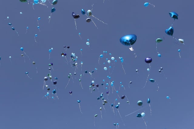 Balloons soar above Staveley Square to honour Logan.