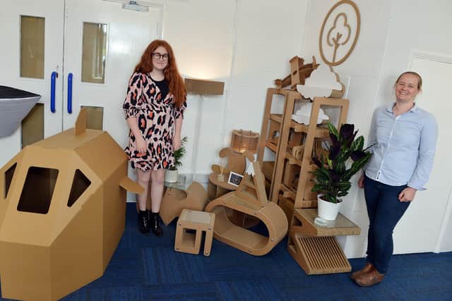 Designers Lizzy Barker and Katie Galley pictured with their cardboard creations.